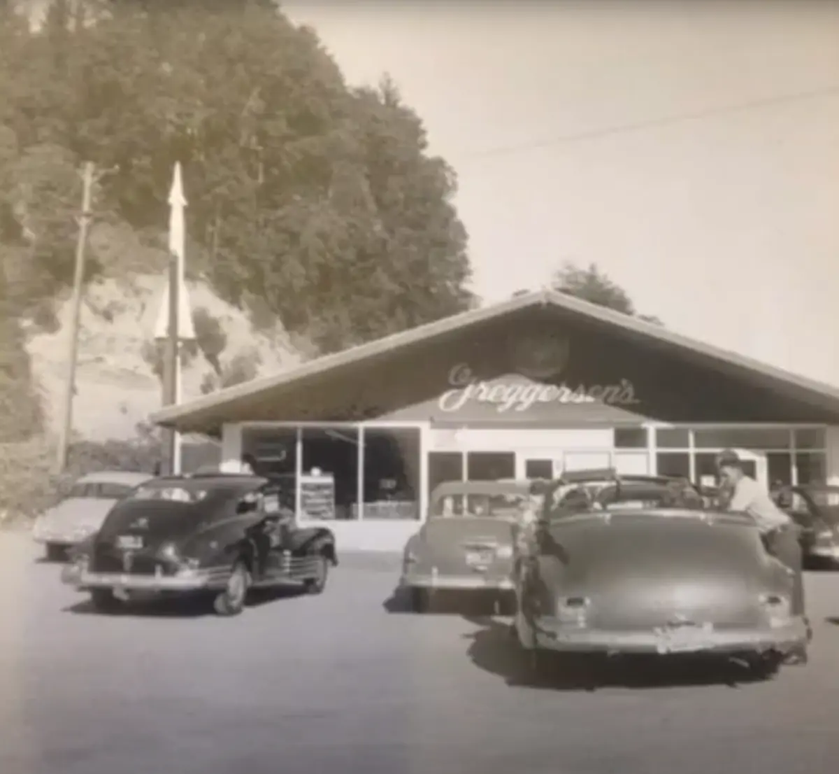 Greggersen's, a low gabled building with a script sign, and 1940s cars parked out front